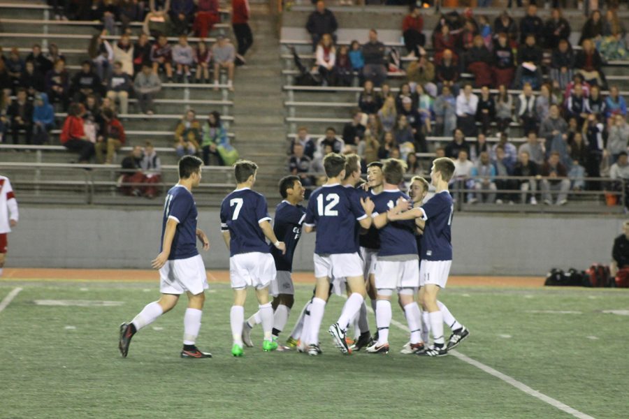The soccer team celebrated a goal.