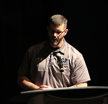 Coach Bender gives a speech at the awards banquet.