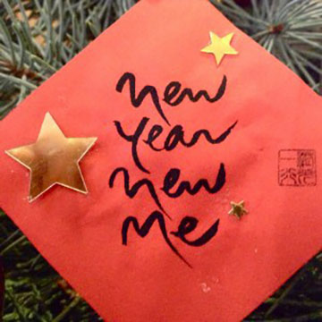 A sign with the famous saying, "New Year, New Me".
Credit: Polewithpeaches.com