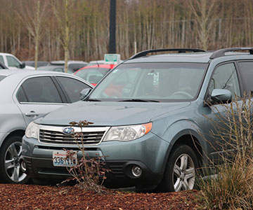 A staff members car parked in the lot.