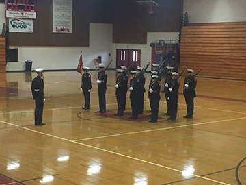 The team practices their color guard routine.