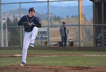 Skyler Kelly winds up for a pitch against a Jackson batter.