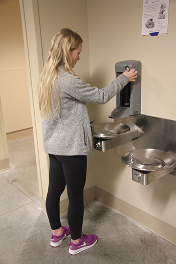 A student fills up a water bottle.