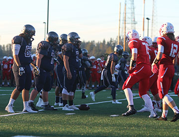 The players line up and get ready for the play.