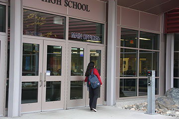 A student walking late during 3rd period.