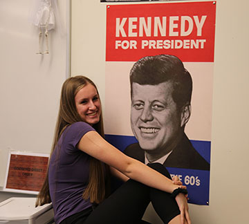 Lizzy Carlson in front of her JFK sign.