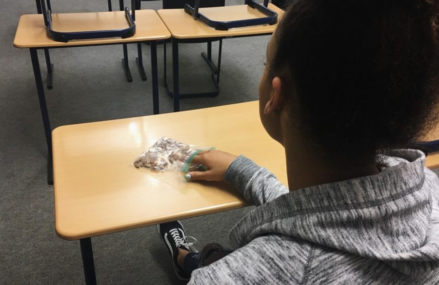 A student snacks before her first period class.