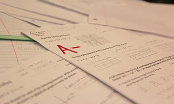 Homework scattered over a table.