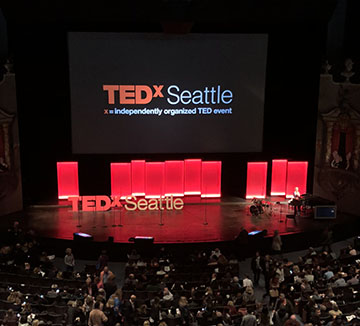 Anticipation for the first speaker to come out fills McCaw Hall.