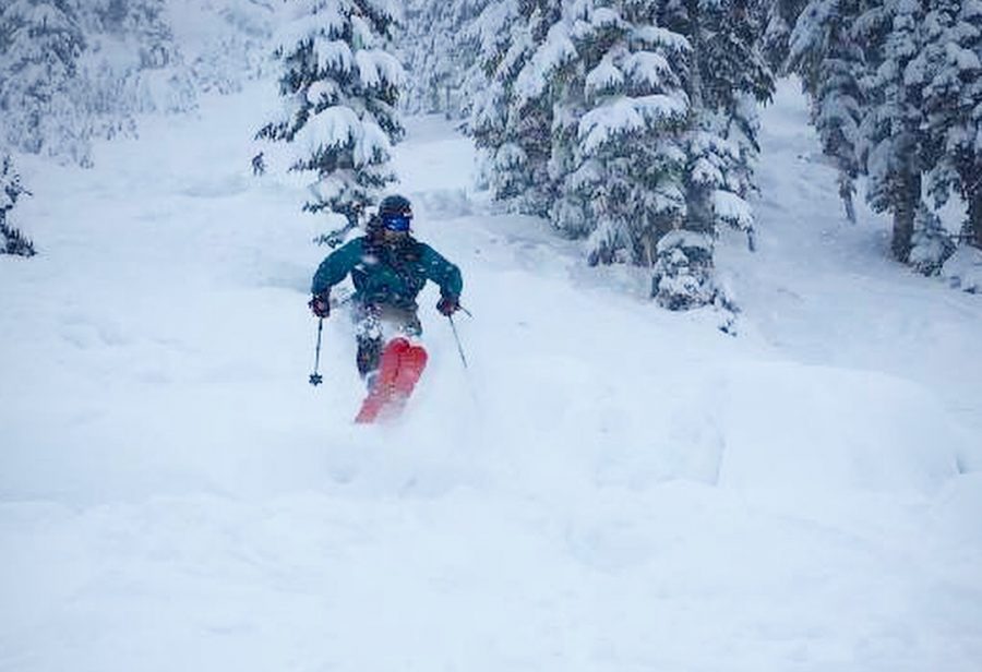 A skier going down the slope.