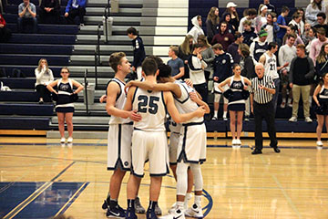 The team in a quick huddle.