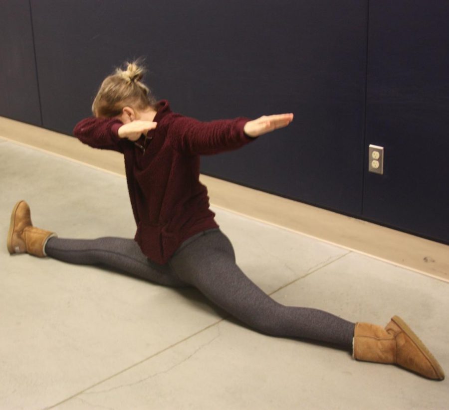 Isabella dabbing and doing the splits.