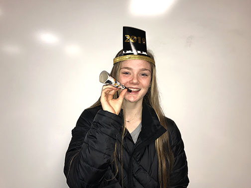 Maddie Seelhoff with a new years celebration hat on.