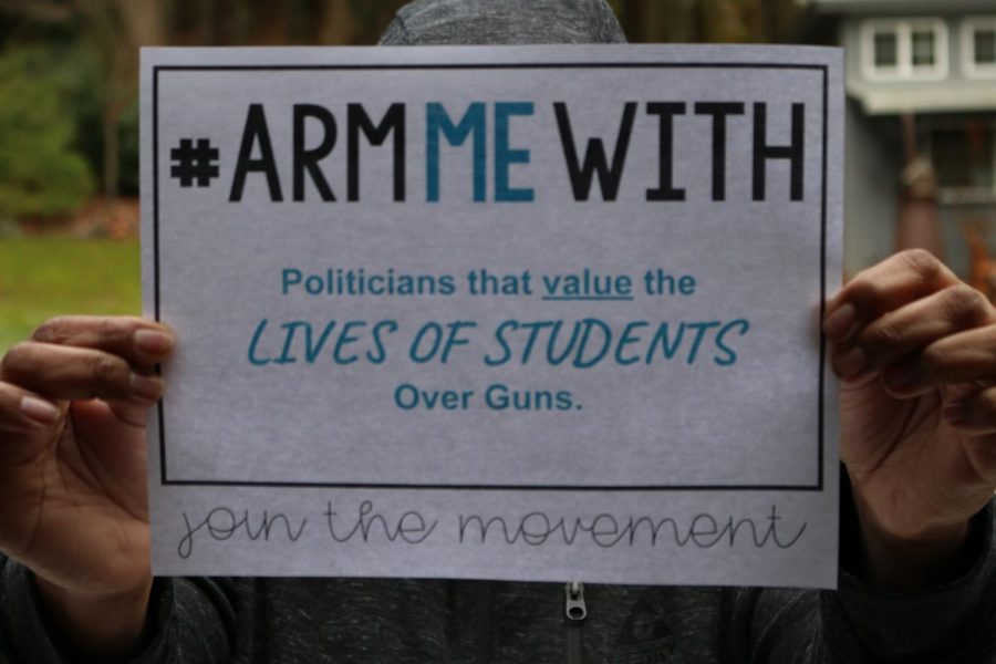 A standard #ArmMeWith sign reading "Politicians that value the LIVES OF STUDENTS Over Guns.