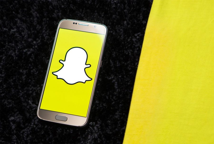A+phone+with+the+Snapchat+logo+on+it.