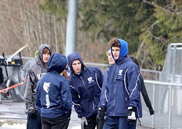 Track runners waiting for their event to start.