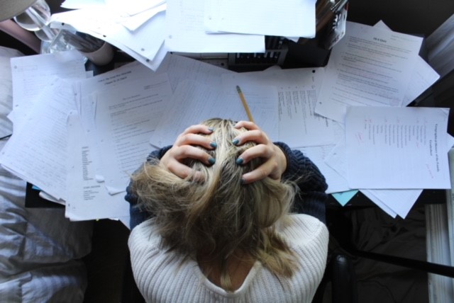 A student stresses over her schoolwork. 