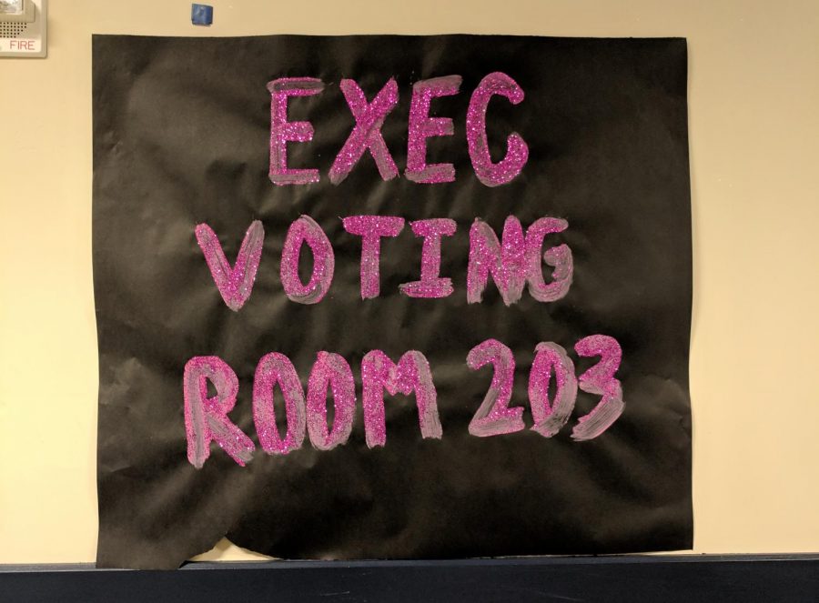 A poster for the voting center in room 203.