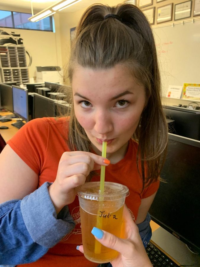 Sipping on a friend's Red Bull Italian Soda, senior Grace McManus stares at the camera.