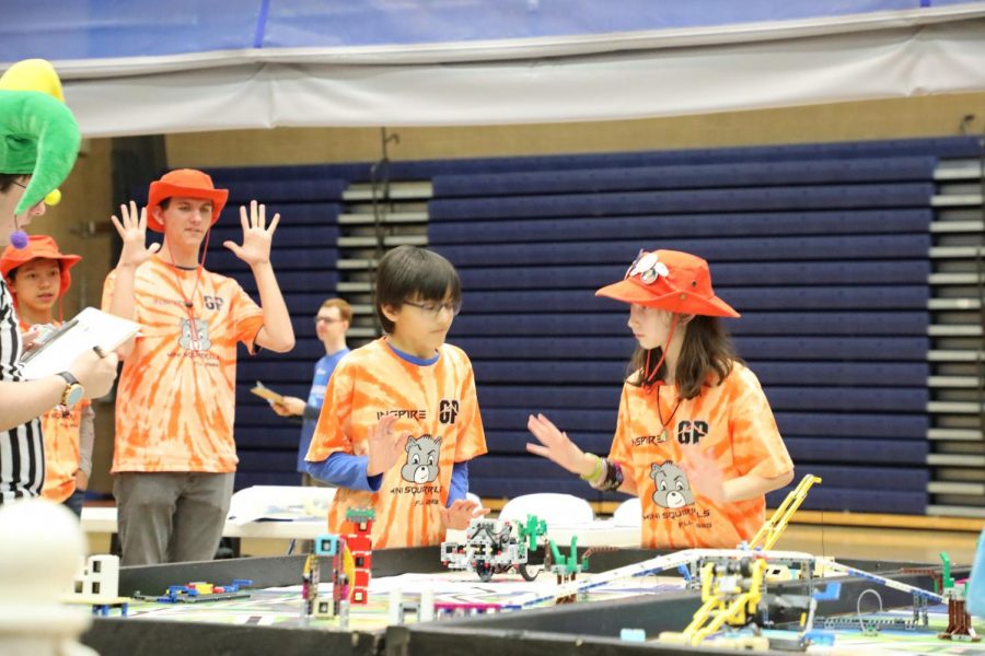 Members of a team mentored by a Glacier Peak robotics student compete with their robot