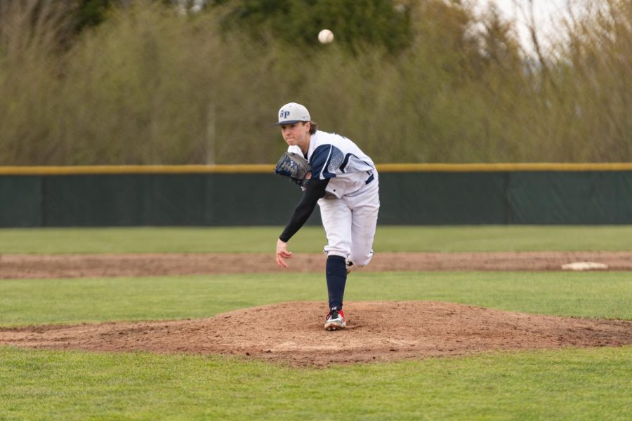 Karsten Sweum fires a pitch home during GPs conference home opener. 