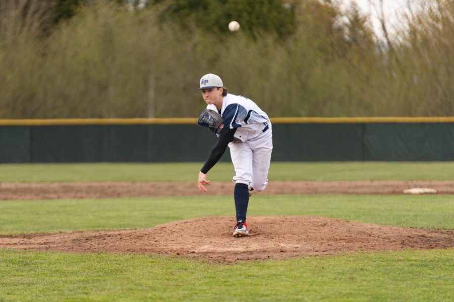 Karsten Sweum fires a pitch home during GP's conference home opener. 