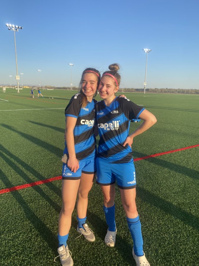 Clara Diepenbrock (right) poses in front of a soccer field during an Arizona tournament for Rush 06.
