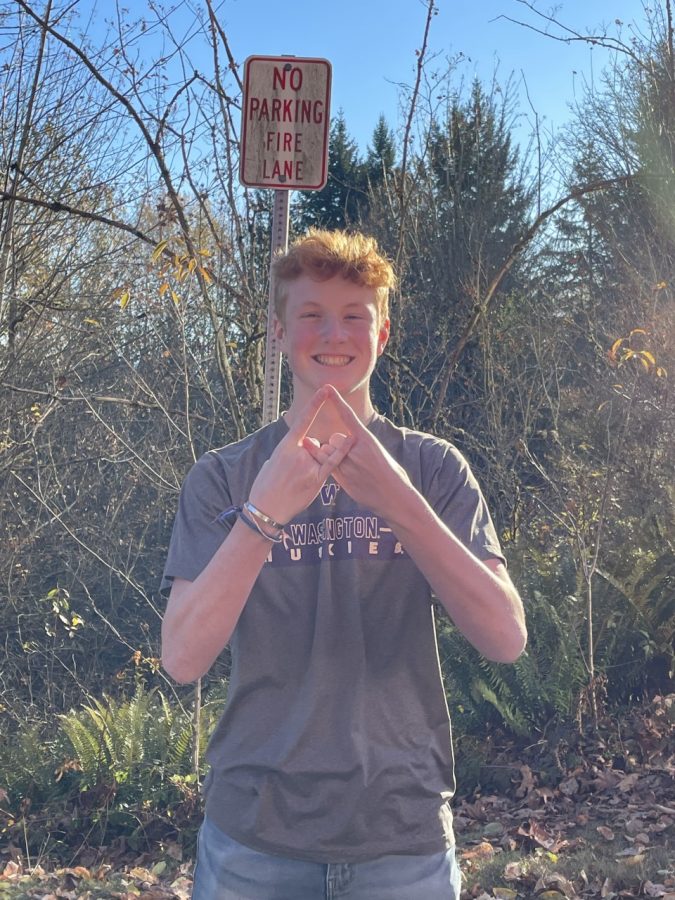 Jack Allman shows off the DECA symbol.