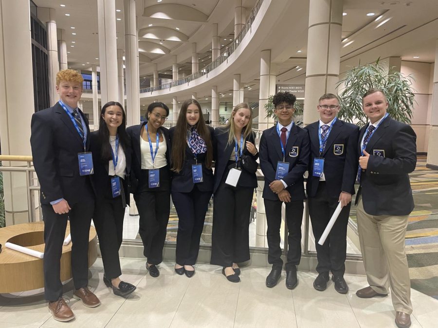 Dressed in DECA blazers, GP students make their way to opening session at ICDC