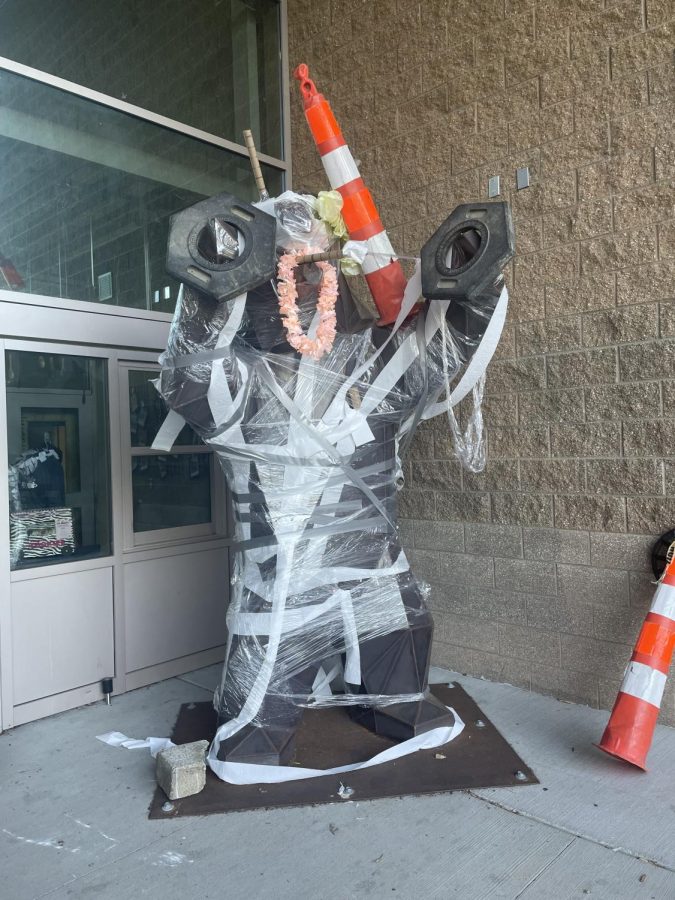 The grizzly bear outside the commons entrance. Covered with toilet paper, saran wrap, duct tape, and topped with a traffic cone.