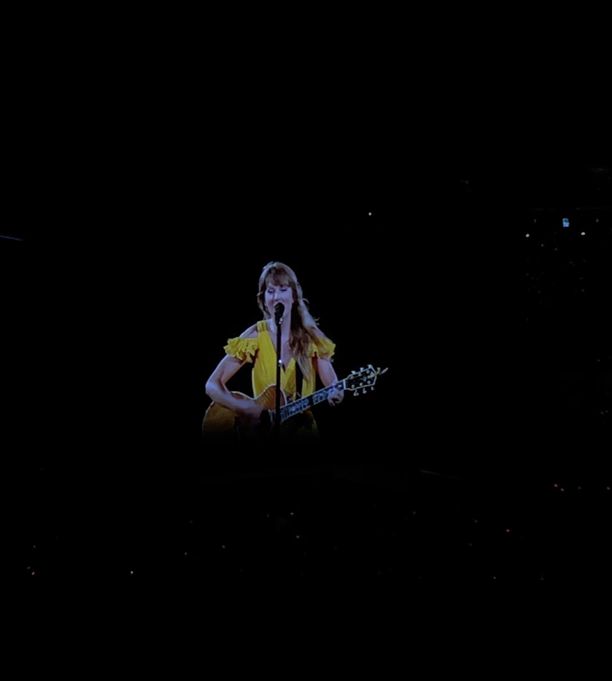 Taylor Swift performing surprise song one during night two, "Message In A Bottle (From The Vault)".