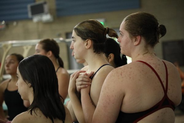 During a dual meet against Archbishop Murphy High School, divers Caitlyn Smith and Addy Clarke get ready for Event 5, Diving.