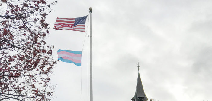 The US flag and the transgender pride flag fly in the wind on Sunday afternoon, Nov. 20, 2016.